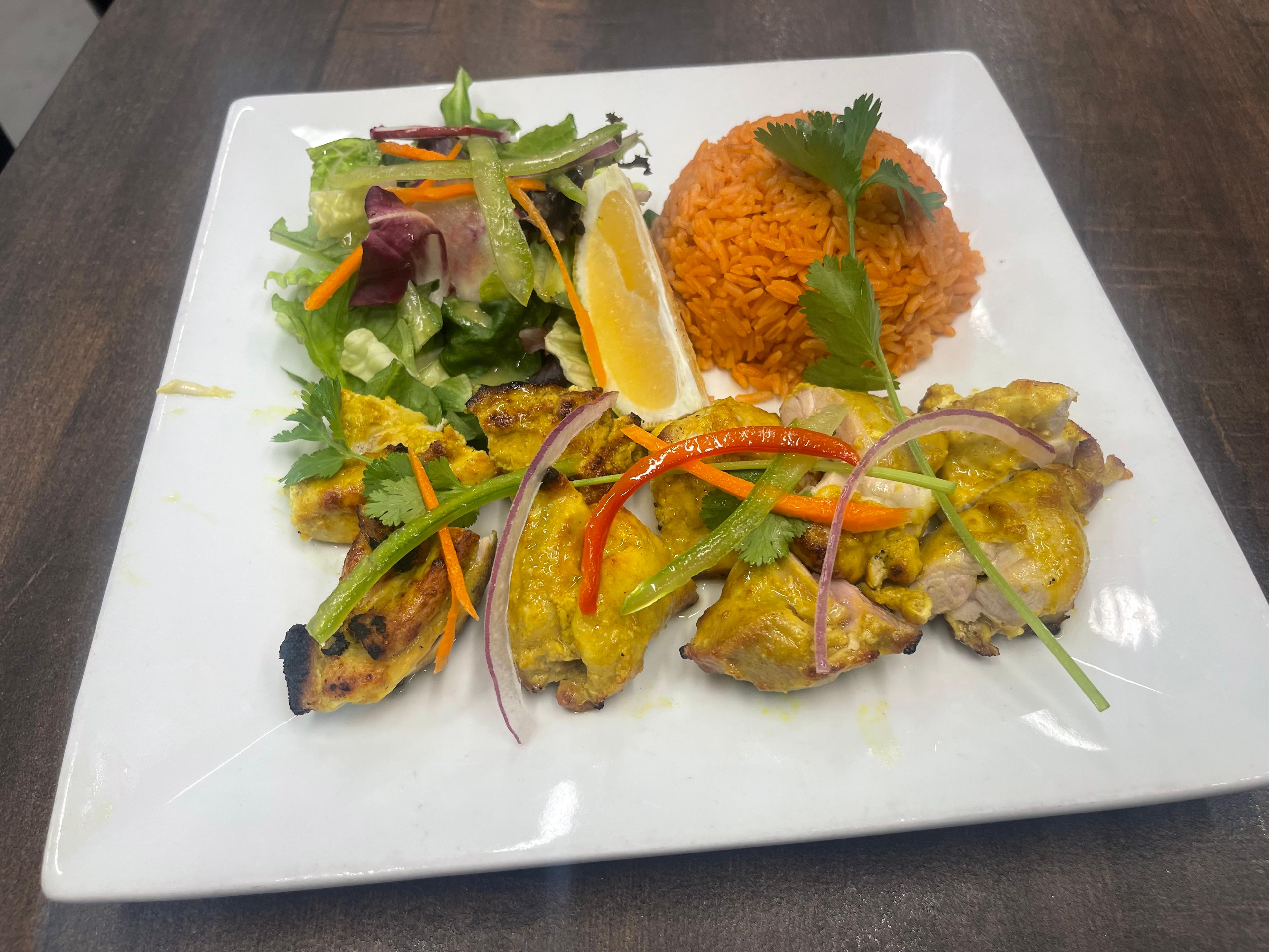 Chicken sekuwa served with fresh garnish