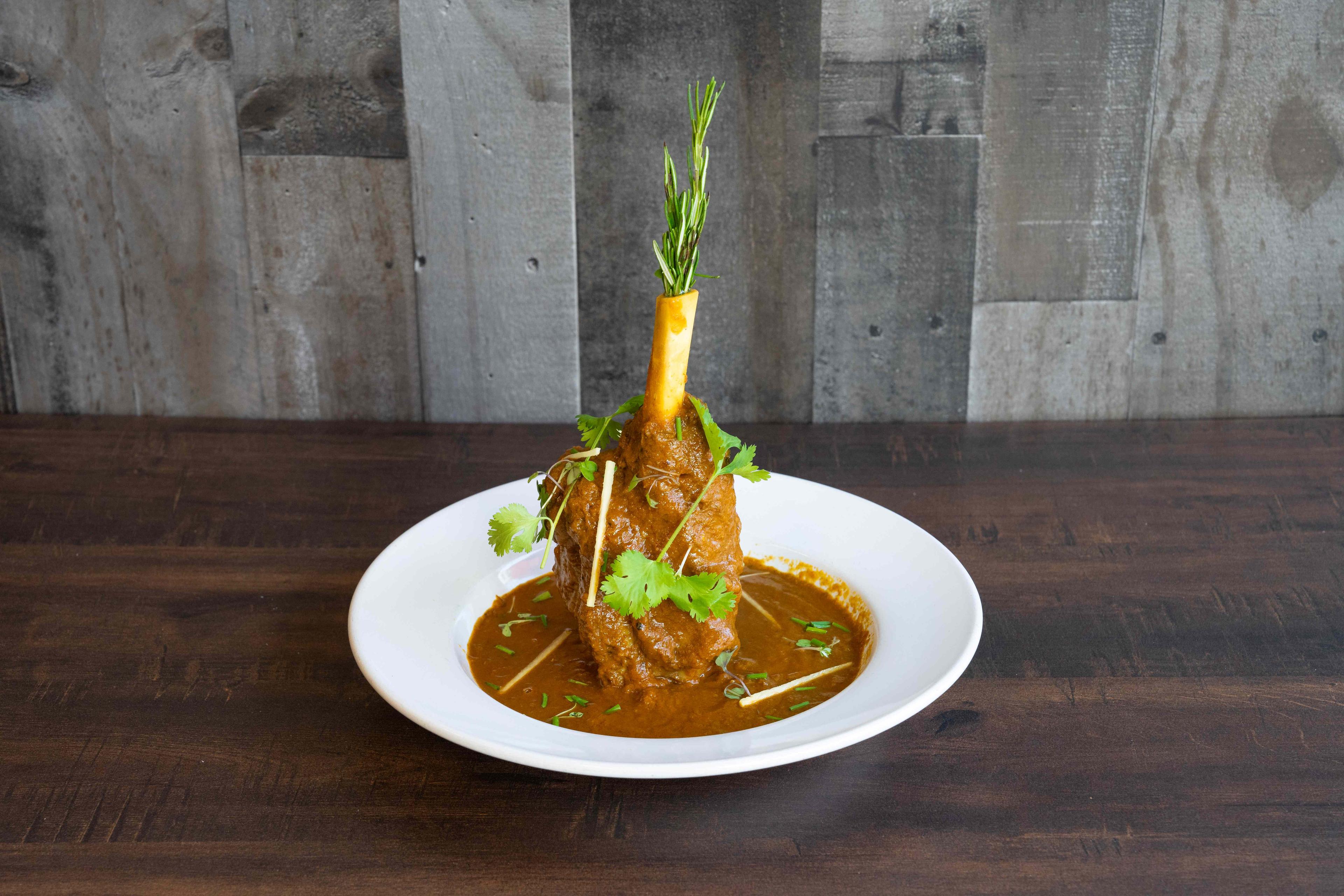 Lamb kebab served with herbs and spices